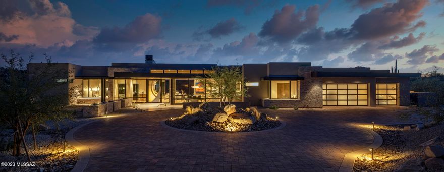 Charming desert modern home has been designed by highly sought-after architect, Marc Soloway, for this golf course lot on 1.119-acres in the exclusive guard gated Stone Canyon.  This single-story home has been thoughtfully designed with floor to ceiling windows to maximize the spectacular views of the Catalina Mountain, rock outcropping and golf course. Enjoy the 4527sqft of open floor plan consisting of 3 spacious ensuites and 5 bathrooms along with an office and den/family room.  The home has been outfitted with luxury in mind from top to bottom.  The chef's kitchen has everything you will need to entertain including a butler's kitchen, two dishwashers two ovens, large refrigerator and separate freezer and over-sized island  Open up the large slider to allow for optimal entertaining space by bring the patio to mesh with the indoor living space. This is a rare opportunity to own a home on the golf course.  Don't let this one slip away.
Stone Canyon offers one of Arizona's best golf courses and has been ranked among top 100 in the nation according to Golf Digest with over 1400-acres of a private master planned golf community. Consisting with endless social activities, Clubhouse, biking and hiking trails and the convenience of the health and Fitness Club offering lap pool, jacuzzi, tennis, pickleball and a large newly renovated gym. Join in with your fellow neighbors in the many social and fitness activities planned throughout each week or schedule your private spa service and enjoy the tranquil surroundings