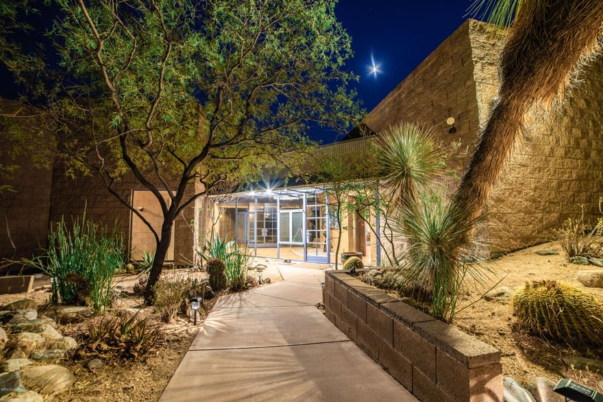 Rare Opportunity! 41.67 acres of stunning Arizona cactus, boulders, wildlife and views. This contemporary block, steel and glass home comes with a separate guest home. This custom pool with its outdoor patios and gardens have the most amazing view anyone could ask for.  Master Suite has its own private patio with spa. This home has paths that will take you to a zen garden with water feature, outdoor kitchen, and garden with greenhouse. Follow another path to a  gazebo on a high point with gorgeous views for miles.  Home is solar powered with excess electric sold back to TEP. Private well. Home available on 11.67 acres for $850,000 or $1,320,000 on 41.67 acres.