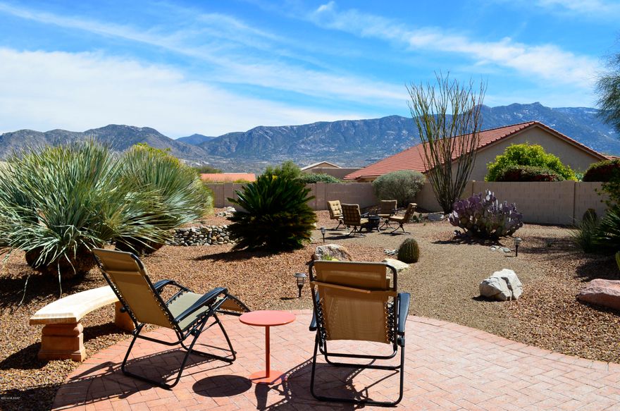 Private Lariat (Sedona) Model with a Contemporary Décor and Sweeping Catalina Mountain Views from Inside & Out. The Open Great Room Design, Vaulted Ceilings & Plentiful Windows Create a Light & Airy Ambiance. Kitchen with Slab Granite Counters, Center Island, Walk-in Pantry, Breakfast Bar & Gas Range. Sunny Breakfast Nook. Dining Area Accommodates a Large Table for Entertaining.  Spacious Master Suite with Office or Sitting Room. Sleek Master Bath with Double Sink Vanity, Walk-in Closet & Shower with Custom Tile Surround. Comfortable Guest Room & Updated Guest Bath. Den & Laundry Room with Cabinets Plus a Separate Office. Private Outdoor Living Space with Shady Covered Porch, Extended Brick Paver Patio, Built-in BBQ Grill, Impeccable Landscaping. Meticulous Move-in Condition.