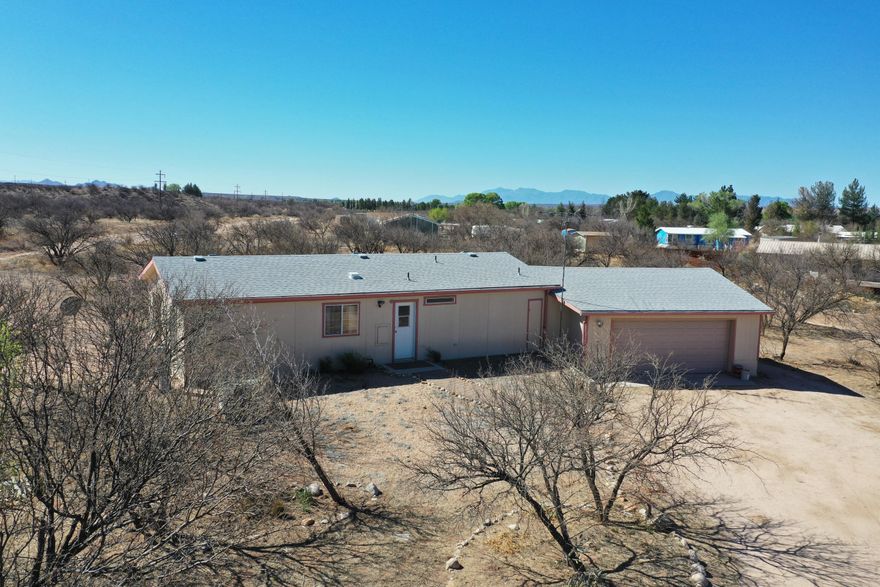2 bedroom, 2 bathroom on 1.29 acres. Mature mesquite trees. Large 22x28 garage. A/C and upgraded dual pane windows. With a little TLC this home could be beautiful.
