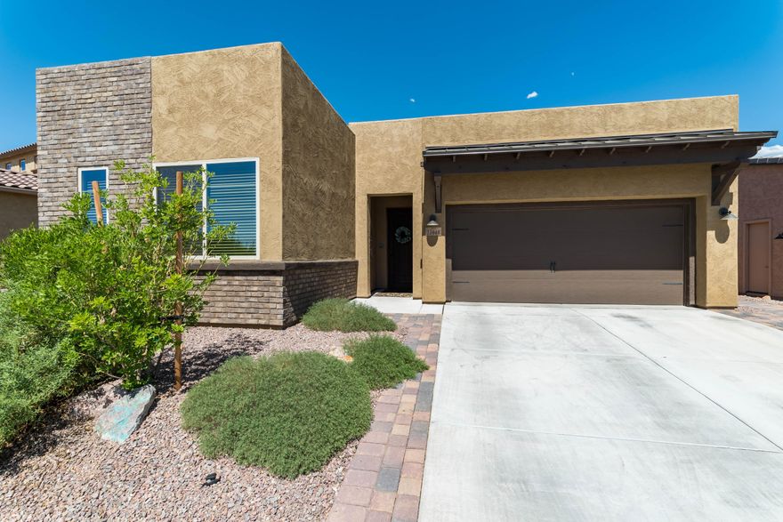 Like new, but without all the extra work! The two bedroom, den and 2.5 bath home is ready for you to move in. This well appointed home offers a neutral color palette, stunning ceramic wood plank flooring in all of the main living areas, carpet in the two bedrooms, and off white cabinetry throughout for a seamless design. The kitchen hosts granite counters, a blanco sink, gas cooktop and a stylish backsplash. Custom drapery add elegance to the great room + master suite. California closet systems can be found in the master and in the den's walk-in closet. If this isn't enough to convince you, step outside to the majestic views of the desert and the Catalina Mountains. Although this yard is petite it feels as though the desert is never ending with the natural preserve backing to the property.