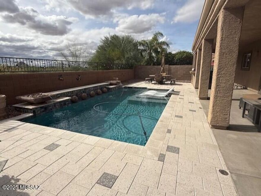 Gorgeous two story home in the sought-after community of Saguaro Bloom! Nearly 3200 sqft of open and airy floorplan. The diverse space gives you so many living options, be it large family accommodations, game room, mother-in-law quarters, etc. Seller's have done some major refreshing, including exterior painting of the home and wall, fresh decorative rock, and newer kitchen features (Dishwasher, refrigerator, and reverse osmosis all less than a year old.) The large kitchen opens to the family room and boasts beautiful cabinetry and granite counters. Custom cabinets in the laundry room, bar, and more. Primary shower has been remodeled into a walk-in. Step outside to a resort-like back yard featuring designer pool with cantera water features and lagoon. Enjoy the direct view of Sombrero Peak with no rear neighbor. The full length covered patio will provide a great retreat from the sun during the day, and the spa will sooth your aches at night.
