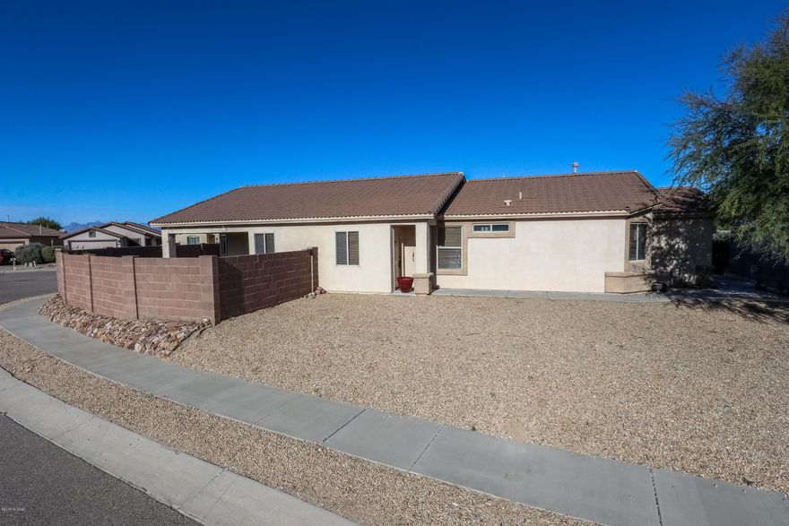 This home is in the award winning Vail School District. It's within walking distance to Cienega High School. This four bedroom, two bathroom home sits on a corner lot. The kitchen is newly remodeled with new cabinets,backsplash and granite counter tops. The great room has been tastefully redone with new ceramic tile. In addition to the remodeling, this home has the added feature of a whole house water softer system. This must see home has many extras that make it stand out. Come see this wonderful home today, it won't last!