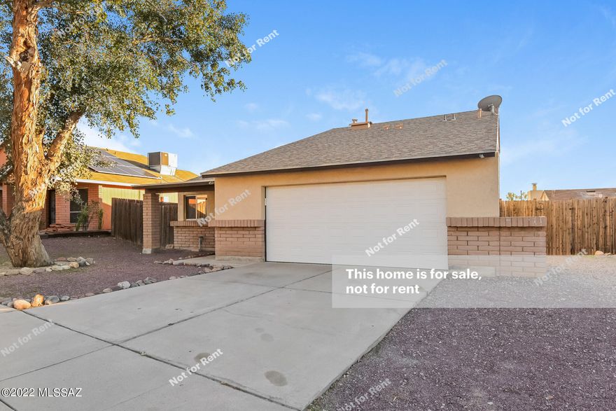 This Tucson two-story home offers a two-car garage.