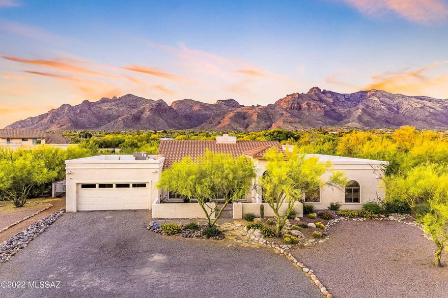 Single level, 4 bedroom, 3 bathroom home located on a cul-de-sac in the highly desired Shadow Hills community. Views of the Catalina Mountains, high vaulted wood beam ceilings & expansive floor plan. Double sided wood burning fireplace between the large living room 
 & comfortable family room. Kitchen with granite countertops, stainless-steel appliances with adjacent laundry room, which incl. washer & dryer, large pantry, & accessible powder room. Spacious primary bedroom w/ fireplace + additional flex space for an office or workout room. Primary bathroom includes double vanity, separate shower, soaking tub, and walk-in closet. 3 guest bedrooms and guest bathroom w/ shower & tub. Incredible views of the Catalina Mountains from the expansive, entertainment friendly backyard with pool & spa