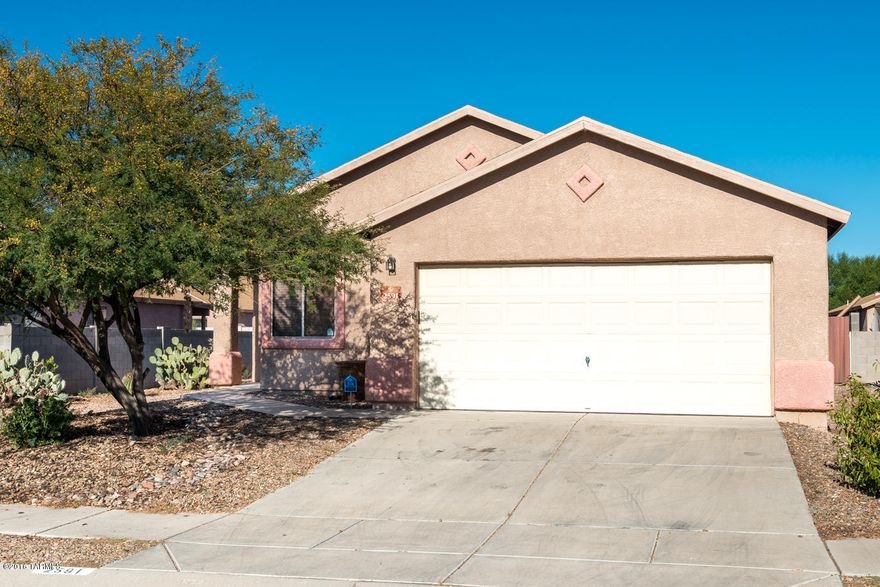 Contemporary 3 bedroom + den, 2 baths & 2 car garage built in 2002! Formal living and dining room along with open kitchen/family room. Kitchen has tons of counter space & storage as well as new kitchen sink and newer stainless steel kitchen appliances. Large master suite with walk in closet. This home is loaded with upgrades! New water heater 2015, new AC 2015, remote ceiling fans in every room, new faux wood blinds throughout, new bathroom faucets & light fixtures. The garage floor is epoxied. Both yards are landscaped. Backyard has covered patio, extended paver patio, garden on a watering system, grass & citrus. Block was raised up 2 feet for privacy.