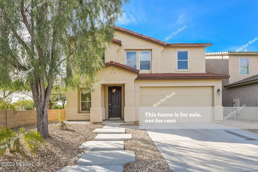 This Tucson two-story cul-de-sac home offers an in-ground pool, a patio, granite countertops, and a two-car garage.