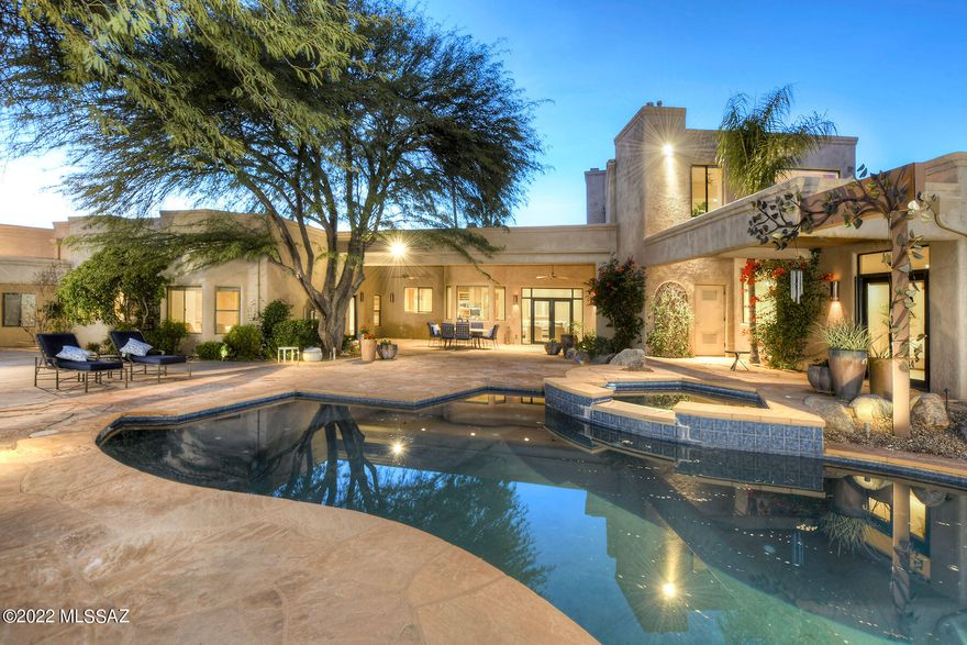 Set on one of the very best view lots in popular Shadow Hills this 4837 sqft beauty is host to a fabulous split floor plan complete with guest wing, a play room/tv room AND gorgeous home office with stunning mountain views, luxurious primary suite with spa-like bath, huge owner's closet, entertainer's kitchen w/2 Dacor ovens, 2 Asko dishwashers, gas range & center island breakfast bar open to the Great Room PLUS formal living and dining rooms. The rear yard is spectacular: lush & green w/mature vegetation,  wonderful pool, spa, grass, palm trees, backed up to common area for terrific privacy & wonderful mountain vistas.  New carpet in all bedrooms and fantastic floor plan provides flexible livability and a bonus second owner's suite. 2 garages for a total of 4 cars! Fabulous Foothills gem!