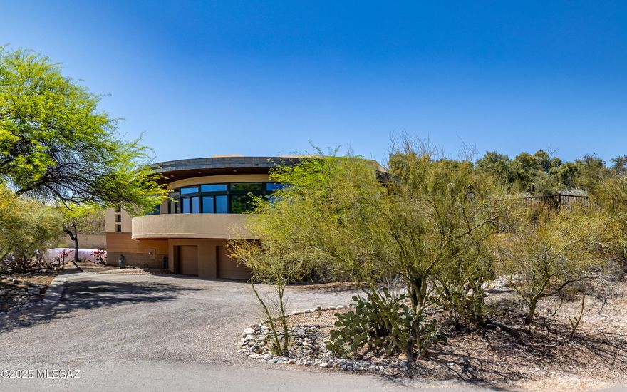 Spectacular Contemporary w/walls and walls of great room windows gazing out to panoramic city light and nature views. Beautiful custom cabinetry, wood floors, stone, rich features throughout. Gourmet kitchen w/stainless steel appliances. Grand great room w/relaxing fireplace and one of the most stunning warp around porch.  Relax in the sparkling pool or under a deep cozy, private porch. Sprawling home with many private retreat areas. Nested in heart of the Foothills - near everything yet hidden in privacy.  Call for private showing.
