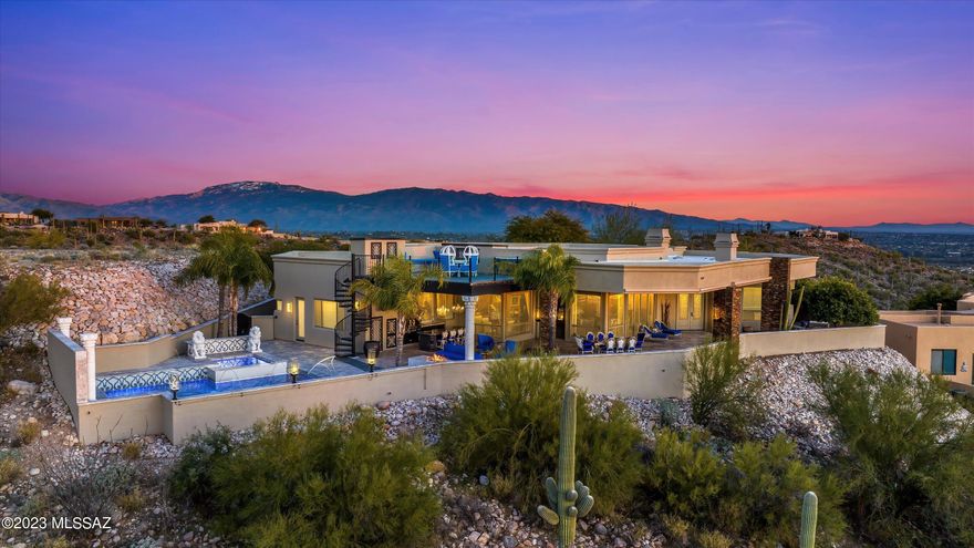Home Tour Winner! Lions' Lair A Stunning Hilltop Retreat with Breathtaking Views in Prestigious Gated Sabino Mountain. Masterfully Designed Tuscan Style Single Story. Elegant Gated Courtyard & Wrought Iron Doors. Exquisite Great Room with High Ceilings, Fireplace, Walls of Windows, Travertine Floors & Gourmet  Wet Bar. Chef's Kitchen Showcases Large Granite Island & High-End Appliances. Magnificent Owner's Retreat with Marble Floors, Fireplace, Sensational Shower & Huge Luxurious Walk-in Closet. Fabulous Full Length Back Patio, Outdoor Kitchen, Fireplace, Pool, Spa, Waterfall & Upper Viewing Deck. Convenient Foothills Location minutes from World-Class Resorts, Schools, Restaurants & Shopping. Offered Fully Furnished. See Upgrade List, 3D Tour, Floor Plan & Video. Indulge in Complete Luxury