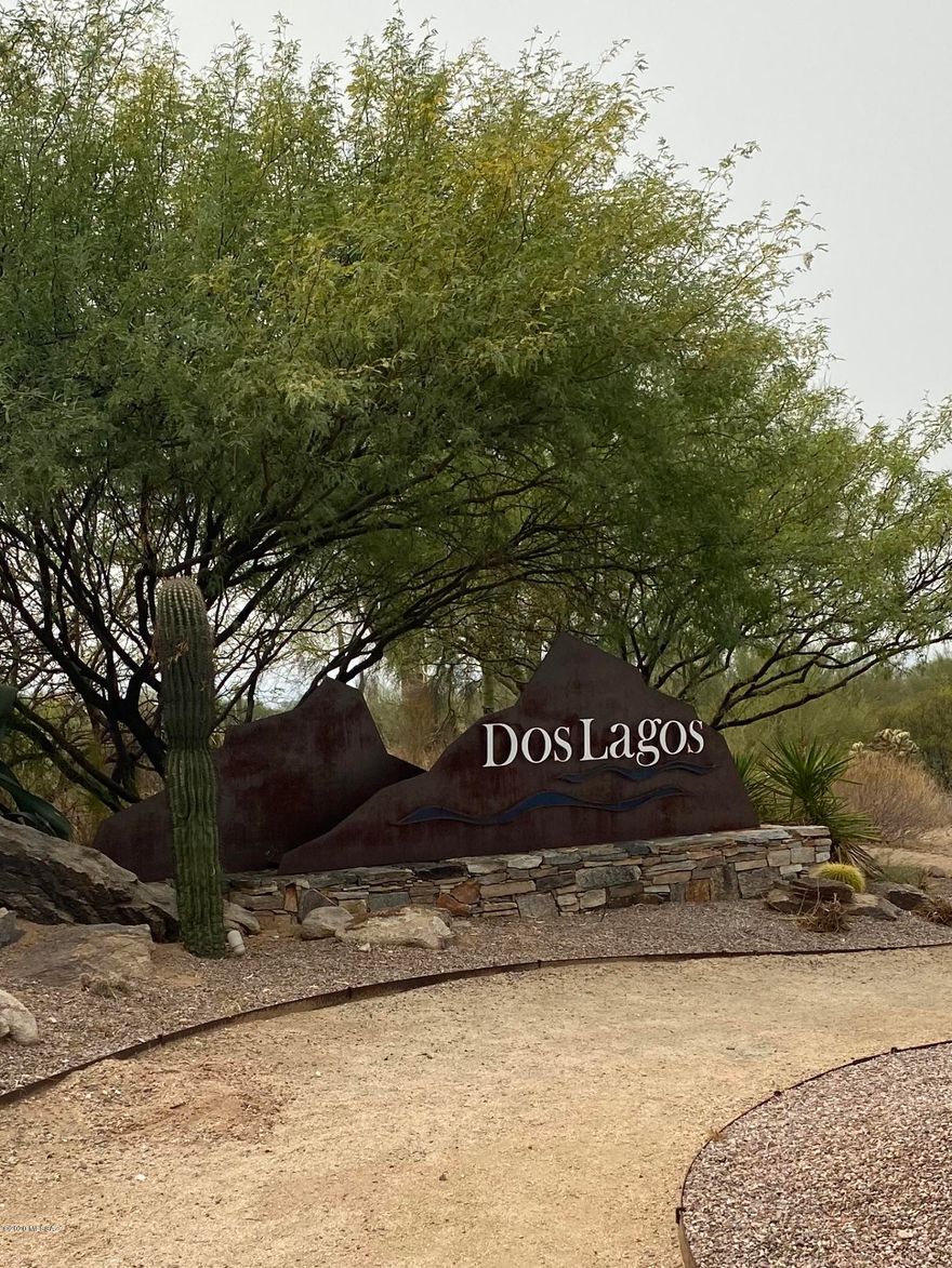 Located in the highly desirable Gated Golf Course Community, Dos Lagos at Dove Mountain. Stunning Semi-Custom Home on Large Lot. The resort like backyard is extremely private and peaceful and looks out at the desert common area. This private oasis is beautifully designed with a pool and spa that has a sun deck, waterfall and fire pits. In addition, an outdoor kitchen with bar, grill, searer and mini fridge. The deep, extended covered patio with a mister system makes it easy to enjoy outdoor living, backyard faces south and this patio shaded all day while the pool gets the sun. The kitchen has been completely redone and showcases hickory cabinets with soft closures, a farm style sink, beautiful quartz countertops highlighted by tile backsplash that ties the room together. An additional pantry cabinet was added, featuring a unique storage system allowing it to hold as much as a walk in and way more organized! French door refrigerator and new dishwasher. The generous sized bedrooms each have there own full bathrooms. Recently custom painted interior.  Beautiful custom made knotty Alder interior doors. The recently enclosed courtyard gives another area to enjoy the views of the mountain in the afternoons or mornings, it is secure, totally irrigated for plants and has electricity for lighting, both gates were custom made.The office has custom built in wooden bookcases. The office and the sitting room/front room have solid wood custom built shutters. Large Laundry with cabinets and counter space. Ideal Dove Mountain location surrounded by the Gallery North and South Golf Course and adjacent to world class Ritz Carlton Resort and Golf Club. Enjoy the many hiking and biking trails in the area. Close to the freeway and the Outlet Mall.