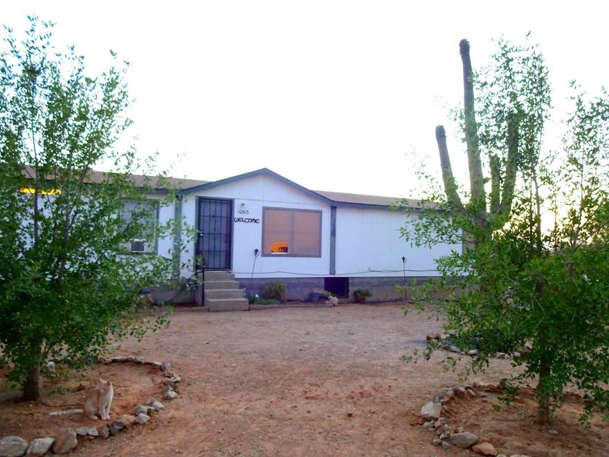 Country living on 4 acres just 30min from down town Tucson and in the Marana school district!  Large home featuring a split floor plan and two living areas! Big master bedroom with walk in closet, on suite has shower, garden tub, and double vanities. Fully fenced property has mountain views, beautiful saguaros, and mature trees throughout. Saguaro national park starts at the end of the street!