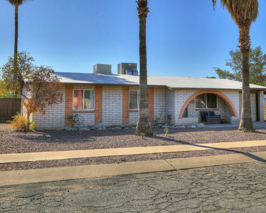 Updated 3 bedroom 2 bath home on large lot with great Mountain views. Spacious eat in kitchen features newly painted cabinets and loads of counter space. Open family room offers flexible floor plan! Generous sized master with upgraded bath and its own covered patio. Easy care tile throughout home. Entertain under the long covered patio or Ramada and enjoy the fire pit on those cool Tucson nights. 1 car garage with extra storage and additional covered carport. Newer fence, HVAC and large laundry room.  No HOA.