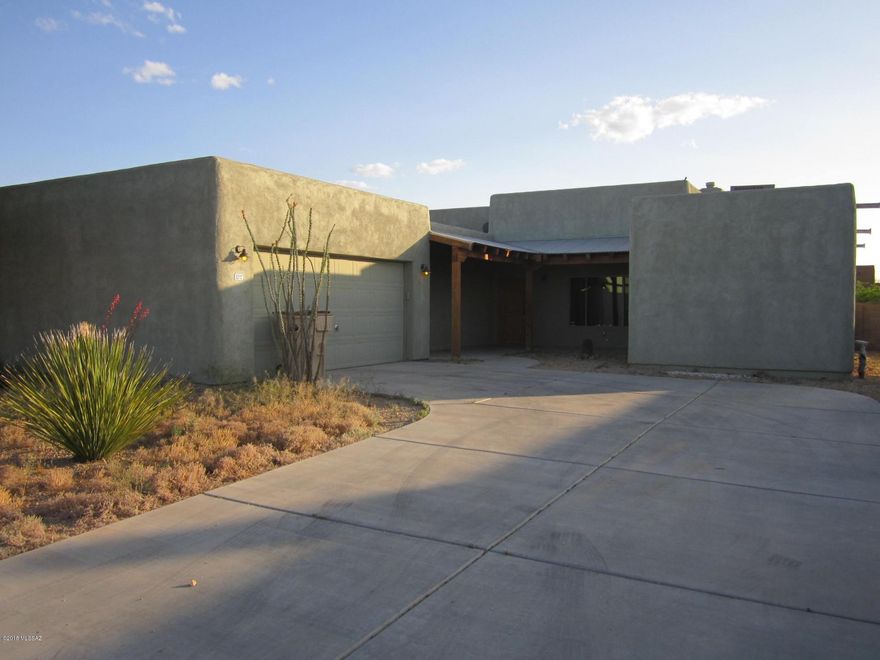 House built in 2006, 1700 square feet, 3bedrooms, split master bedroom floorplan plan. Tall ,beamed great room with kiva gas fireplace , adjoining large kitchen and dining.  Custom tiled main areas , carpet in bedrooms. separate full laundry room.  All appliances convey with the purchase of the house. Fully wired for door/window alert/alarm.(ADT system). White elastomeric roof coating applied to reflect the sun, reduce 
attic heat/help seal the roof against leaks ,extend roofs useful life.
Shaded front courtyard. Large ,open backyard has a gate. Potential area for pool, guesthouse or?
Low water desert landscape with mature shadetree out front and young trees planted in the very large backyard. Full covered patio with some verticle sun shading, plants.  Low yearly cost HOA fees inc. the trash pickup service. Well kept subdivision and nearing
full buildout may well increase demand for Eagle Point Estates.
Casino del Sol [with gambling, entertainment, restaurants, supurb golf course, special events], newer schools and parks nearby.
Please verify all schools, parks, etc.