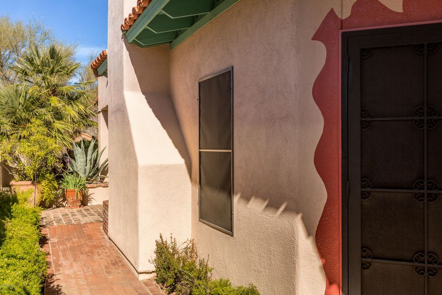 $20,000 in Recent Improv: incl. New  Roof w/5 New Skylights to let in the light! Gracious Southwest indoor/outdoor living in lovely 2bd/2ba plus den in gated Kachina Hills. Open floor plan; lg covered AZ Room (not incl in sq ft) w/brick floor & superior view of Catalina Mts, + open area for sunning, hot tub, & gardening. Vaulted ceilings, Plantation shutters, Dual-pane energy-saving windows & more! Kit & den w/wet bar open to bright atrium. Authentic Mexican tile in kitchen and bathrooms; Talavera sinks; Saltillo floors; walk-in showers w/built-in seats; carpeted bedrooms. Custom paint in lg. master bdrm, den, & kitchen for true Southwest flavor. 1/2 blk to community heated pool/spa. 1 mile to Safeway,CVS,& cafes & 3 miles to La Encantada. Range Price is $380K to $390.