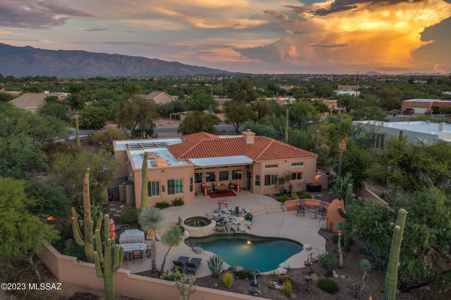 Welcome to your desert oasis- a true retreat that is nestled on .83 Acres of canvas desert landscape. This exquisite property features 11 ' ceilings a split floorplan, 3Bedrooms +Den/Office, 3 Bathrooms & a 3 car garage. Recently renovated with New energy-efficient windows & sliders that invite the desert's beauty indoors. Walk upon new wood-look tiles, & enjoy the new bathroom showers & fixtures. Discover comfort at your fingertips w/ electronic shades indoors & on the patio.Newer water softener & RO system. New pool tile, new decking, & new pump, complete with a pop-up cleaning system. Solar garden lights adorn the landscape alongside fifteen majestic Saguaros and native desert vegetation. Experience the advantages of owned Solar. Unforgettable sunsets & Mountain views are yours.