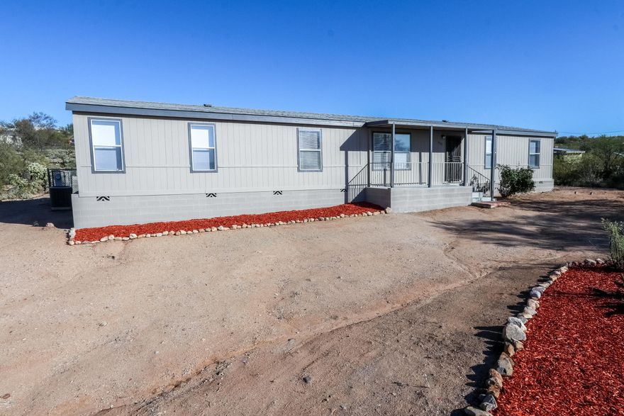 Check out this beautiful remodel in the Vail school district on over an acre!!!  This large over 2000 sqft home has 4 bedrooms, 2 bathrooms including two separate living spaces, formal dinning, a huge laundry/storage room and large master suite.  The large flat lot has plenty of room for houses, RV, trailers ect...  Enjoy the piece and quiet along with the mountain views!