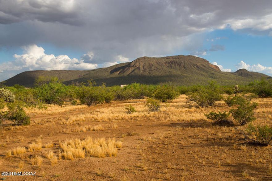 2.02 acres of vacant land lends itself to a variety of use. Ideal for horses, adjacent to open desert to the South and West. Close to the Casinos and Valencia Rd. View of Black Mountain, quiet area with plenty of potential for growth.  Seller will do a Carryback!