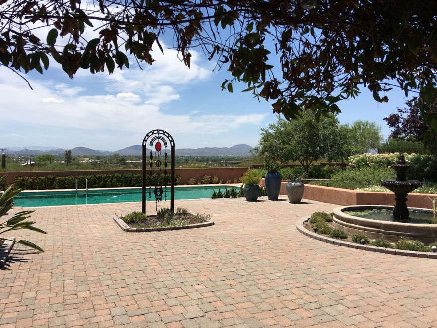 Classic Old Foothills Joesler on large parcel with beautiful views. Overflowing with rustic charm and elegance. Gorgeous fireplaces, beams, flooring. Expansive outdoor patios, pergolas, terraces, huge pool. Guesthouse currently used as fantastic artist's studio. Unique, quiet, private, true Southwestern hacienda ambience.