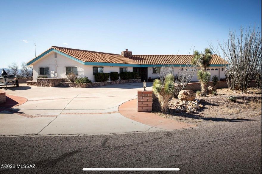 Breathtaking panoramic mountain views from this hilltop lot.  Includes 2 parcels with is over 8 acres!  2062 sq ft of living space which includes 3 bedrooms, 2.5 bath.  Extended 2 car garage.  Dual pane windows.  Stunning extended kitchen with granite counter tops, stainless steel appliances, large breakfast bar, 2 sinks & tons of cabinets!  Just imagine how many amazing meals cook be made & how many tasty cookies could be made!  Living room with a floor to ceiling stone gas fireplace & picturesque windows. 
Large master suite with a soaking tub & separate shower.  1/2 bath near the laundry room. Backyard oasis includes a large covered patio, paver area, pool & amazing views!    Location is everything! Come enjoy your own slice of paradise!