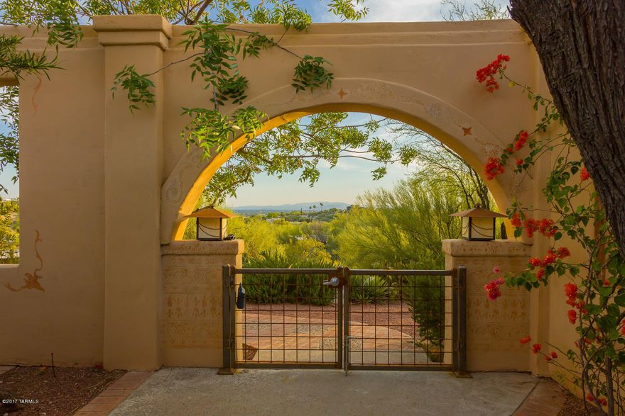 Priced to Sell! Mediterranean style home immaculately maintained & tastefully designed using all natural materials. A courtyard entry with lush vegetation & hand stenciled walls sets the scene for what you will find inside. Take in city lights, mountain & sunset views from inside & out. Soft soothing paint colors & rich hardwood floors add warmth. Kitchen with custom hickory cabinets, granite, GE Profile appliances,gas slide-in range, slate back splash & floors. Dining area has views through tall doors & windows.  Hand stenciled gas beehive Fireplace. Multiple outdoor spaces perfect for entertaining. Gardeners delight landscape with fruit trees,vines & an atrium with fig tree. This home just feels good! All furnishings and household items are available on a separate bill of sale! New copper garage doors with opener. Zone HVAC incudes 2005 Rheem & 2006 American Standard units both serviced March 2017. Termite Warranty, balance of 5 year roof warranty. The list goes on and on for this beautiful home that is a must see and has good Feng Shui! Most furnishing are available for purchase on a separate bill of sale. Excluded are the  painting in the Living Room & Bali Screen in bedroom 2 & African Chair in Dining Room