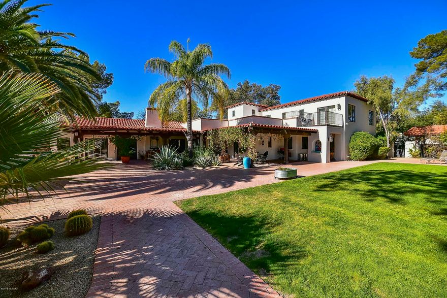 Stunning Spanish Colonial Revival home nestled in historic Colonia Solona. Architecture by Merritt Starkweather, home was skillfully restored and renovated in 2001. Expansive living room with an inviting wood burning fireplace, picture window, and built in book cases. Bright and open kitchen with triple pane skylights, soapstone counters, Wolf range, double-thick butcher block island and counter seating. Gorgeous staircase with custom wrought ironwork and Malibu tile. Mahogany, and concrete flooring, wood beam ceilings, and plaster walls add to the character and charm. Well designed outdoor space with brick patios, mature and lush vegetation, sparkling pool and fireplace make entertaining a pleasure. Period design compliments modern amenities. MUST SEE this truly enchanting property!