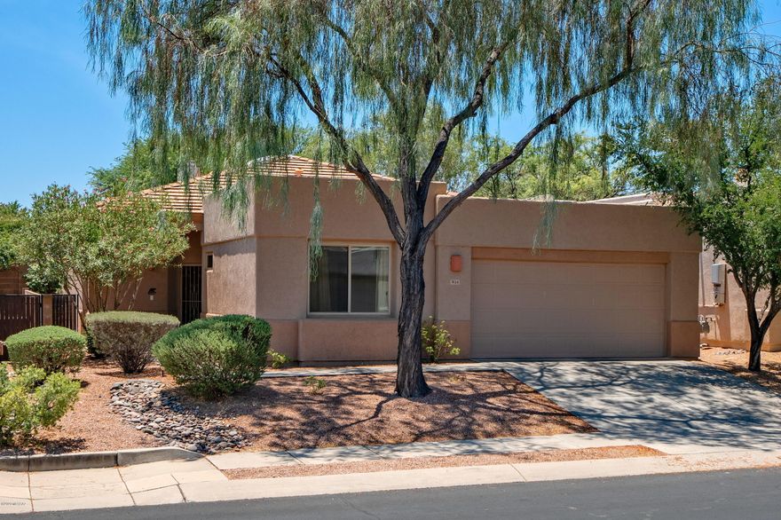 GENTLY LIVED IN, MODEL PERFECT AND METICULOUSLY MAINTAINED AF STERLING HOME IN SOUGHT AFTER GATED COMMUNITY.   CONTEMPORARY FLOOR PLAN WITH VOLUMES OF SPACE AND LIGHT, HIGH  CEILINGS, BEAUTIFUL NEW WINDOWS AND WALL-TO-WALL DARK CHERRY-WOOD LAMINATE FLOORS.  DELIGHTFUL KITCHEN WITH SKYLIGHT AND ATTRACTIVE  ENHANCEMENTS.  CHARMING PATIO AND YARD, PROFESSIONALLY LANDSCAPED AND JUST THE RIGHT SIZE FOR EVERYDAY ENJOYMENT.  2017 HVAC SYSTEM, ROOF WARRANTY AND TERMITE WARRANTY.  YOU'LL LOVE LIVING HERE!  HOA INCLUDES 3 SPARKLING POOLS/SPAS, FRONT YARD MAINTENANCE, TPD ROVING SECURITY AND MORE.  CLOSE TO UDALL PARK, SABINO CANYON, TUCSON COUNTRY CLUB, RESORTS, GOLF, TENNIS, SHOPPING, RESTAURANTS, AND BUS RIGHT OUTSIDE THE GATE.  PERFECT FOR SEASONAL OR YEAR'ROUND LIVING -- JUST LOCK-UP-AND-GO!