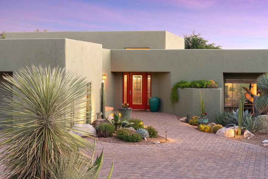 Located in gated Sin Vacas w/privacy & dramatic mountain views, this 3,370sf 3BR/2½BA elegant custom southwest-style home compliments the natural beauty of this unique foothills setting. Blended with a modern flair while keeping the classic warmth of Southwest Style, kitchen has stainless appliances, Fisher & Paykel Range & mesquite counters. Family room off kitchen has library wall & fireplace. Formal dining area & formal living room. Like a tranquil walk in Tohono Chul Park, this property features walkways w/over 100 exquisite specimens of Native Tucson Area Cactus & Succulents. Home features Saltillo tile, Tongue & Groove Ceiling w/wood beams, New Exterior paint 2019, Newer HVAC & HW Heater & paver stone driveway. Relax in the privacy of your backyard w/Lap Pool. 2-car garage.