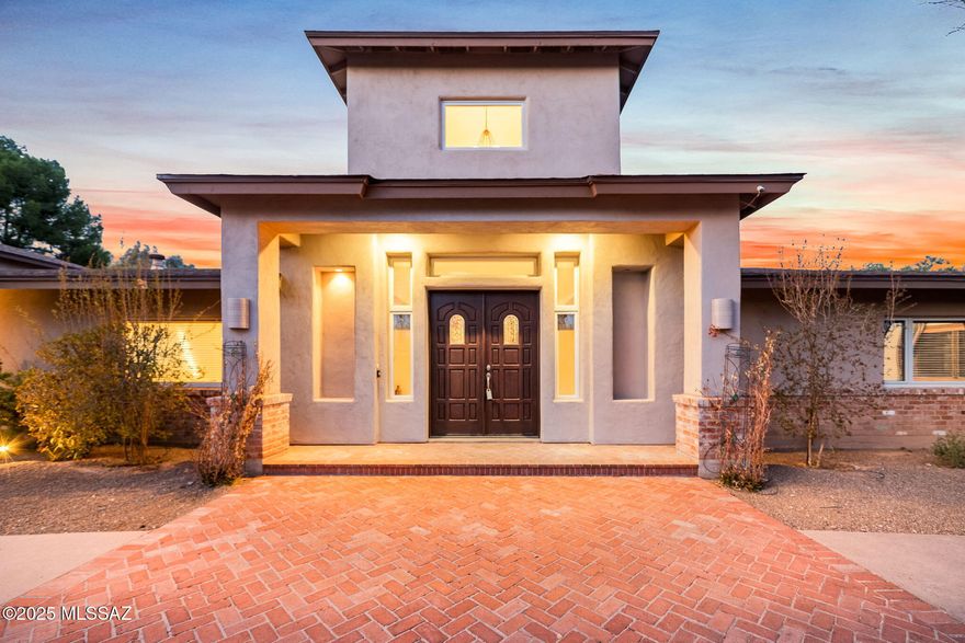 Discover the epitome of luxury within the exclusive Tucson Country Club community with this signature residence! Upon entering through a distinguished and significant double door foyer, you'll be greeted by a stunning great room featuring soaring 16-foot ceilings and a custom stone fireplace! The space is accentuated by built-in, lighted art display bookcases, providing both utility and artistic flair. Culinary enthusiasts will be captivated by the sensational kitchen, adorned with granite countertops, stainless steel appliances, and a convenient breakfast bar. It boasts a gas stove top, double ovens, a prep sink, and even a built-in wine cooler, complemented by ample pantry storage and rich, solid wood plank flooring. The home seamlessly accommodates formal gatherings in the exquisite dining room, complete with a wet bar and a stylish two-way fireplace - a perfect blend of elegance and functionality. The primary suite is a true retreat with spa like bathroom and fireplace. Adjoining the primary bedroom, a truly remarkable library/study awaits, featuring 18-foot high ceilings and walls of bookcases, ideal for the dedicated reader or professional. Guest bedrooms are thoughtfully arranged in a split plan to ensure privacy, each graced with wood-cased windows and elegantly tiled bathrooms. Outside, a Secret Garden offers a private retreat, while the expansive backyard is designed for entertainment, showcasing a covered patio and a beautiful pool amidst serene fruit trees.

Functionality meets style in the pantry/laundry room, streamlining everyday tasks with ease. Don't miss the brand new roof, one new hvac unit, fresh interior repaint, new toto toilets! This property isn't just a home - it's a lifestyle, masterfully combining luxury, comfort, and sophistication. Come explore this magnificent residence that promises to impress at every turn!