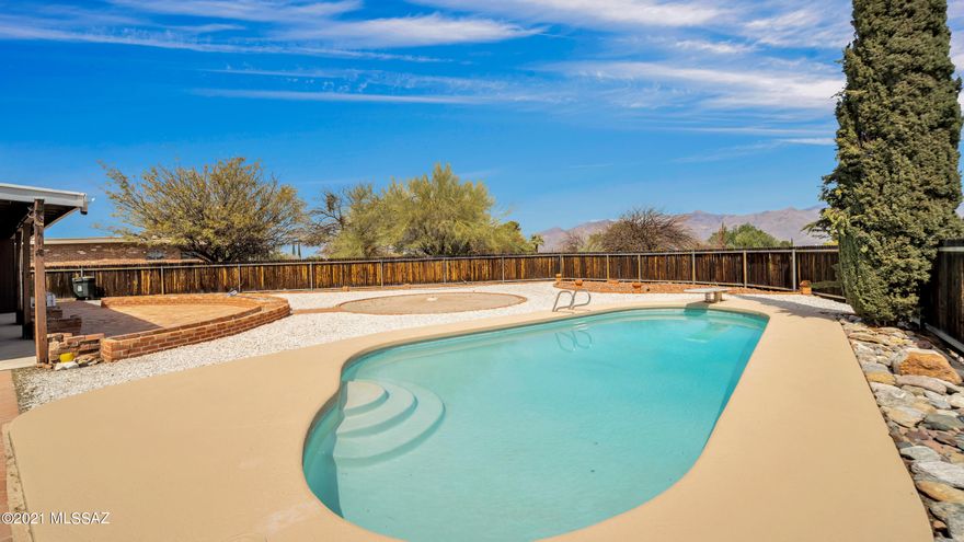 AMAZING mountain views!  And a pool & patio to enjoy it! Situated at the end of a cul de sac, this 3BR, 2 BA home offers you:  foyer, HUGE living room & dining area, family room with raised hearth gas fireplace, family dining space overlooking the patio & a kitchen with newer French door fridge, electric cooktop! Spacious master suite has large walk in closet, roomy tiled shower!  Bedrooms 2 & 3 are of ample size, with closets to match! BRAND NEW CARPET! Freshly painted. Oversized garage has newer garage door. The rear yard offers, open & covered patio areas, sparkling pool with unobstructed mountain views!!!