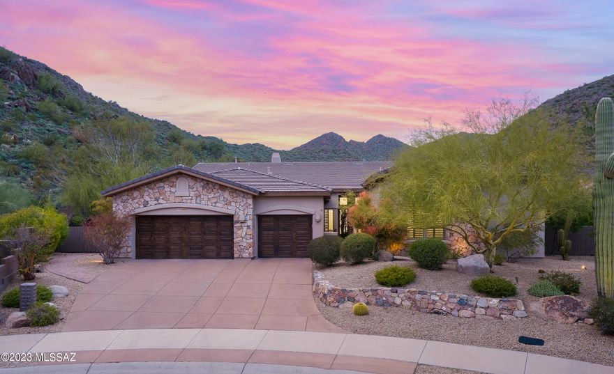 One of the largest lots in the gated community of Hidden Hills is now available. Nestled at the base of the McDowell Mountain Preserve. View fence makes the mountains feel like it's an extension of the property. This tranquil retreat boasts many custom features & landscape designs. Pebble Tec heated pool, custom sunken firepit, large covered patio w electric awning, builtin BBQ, putting green, river flows into Koi pound, large mature trees & a rose garden. Primary bedroom has french doors to the patio, large walk-in closet, spacious bath w his & her vanities. Kitchen/great room offers builtin seating, eat up bar at the island, gas range, dual ovens, granite countertops, with pull out in the cabinets. Interior upgrades include Pella windows with integrated shades, bedrooms w solid wood shut