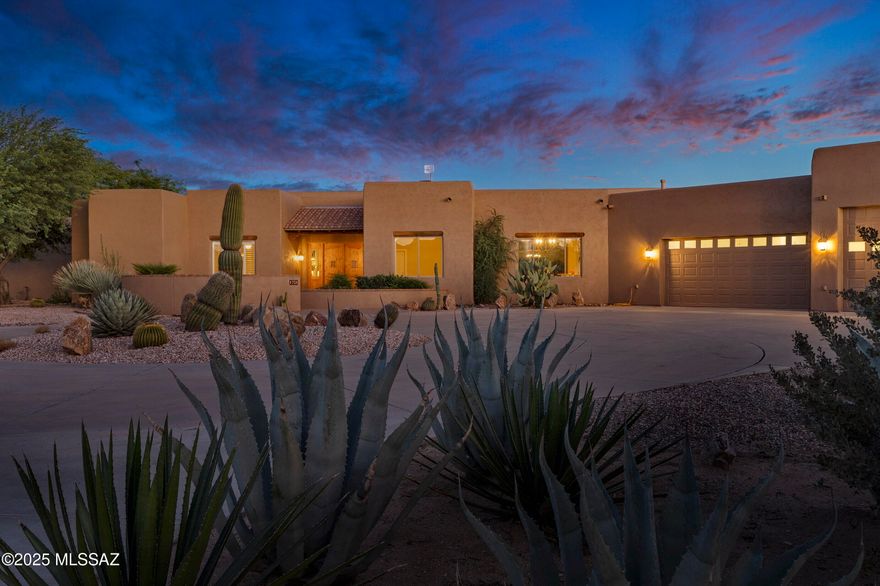 Discover a rare retreat in the heart of Oro Valley, set on 4.55 pristine acres with no HOA restrictions and the benefit of a private well. A long, circular concrete driveway leads to a dramatic entry that opens to retractable sliding glass doors, seamlessly framing breathtaking views of the Santa Catalina Mountains and extending your living space outdoors. Inside, the great room captivates with soaring wood-beamed ceilings, a stacked-stone gas fireplace, and timeless natural stone floors—anchoring the home with warmth and character. This custom five-bedroom, four-bathroom residence offers unmatched privacy, classic design, and sensational views in every direction—unobstructed Catalina Mountains, the Tortolitas to the north, sparkling city lights, and endless desert sunrises and sunsets The chef's kitchen is a true gathering place, featuring granite countertops, a large center island, breakfast bar, custom cabinetry with plenty of storage, walk-in pantry, and premium stainless-steel appliances. A sunny breakfast nook and a formal dining room provide ideal settings for both relaxed mornings and elegant evenings.
The primary suite is a private haven, with patio access, a spa-inspired bathroom offering a walk-in shower, soaking tub, dual-sink vanity, and a generous walk-in closet with custom built-ins.
Outdoor living is at its finest here. A wraparound covered patio opens to a resort-style backyard with a fenced pool, beautifully landscaped low-care grounds, and sweeping mountain and city views.
Car enthusiasts will appreciate the oversized 1,700 SF six-car/RV pull-through garage, designed with epoxied floors, dual front-and-back entry doors, a workshop with stainless-steel sink, and separate storage with custom built-ins.
Though private and secluded, this desert sanctuary is only minutes from all that makes Oro Valley exceptionalrecently recognized as the safest affluent retirement community in the U.S. Catalina State Park, The Loop's 131-mile bike path, premier shopping and dining, and world-class golf clubs including Stone Canyon and The Gallery are all close at hand. With quick access to I-10 and Phoenix Sky Harbor Airport, this property offers the perfect balance of tranquility and convenience.