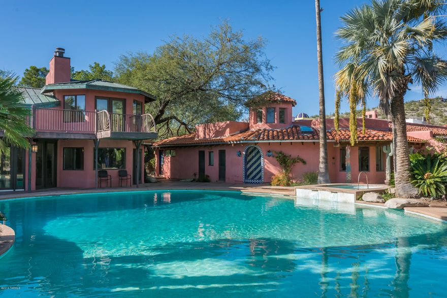 Magical, whimsical and spiritual only begin to describe this enchanting estate that is like no other you have ever seen. From the amazing architectural & ceiling details throughout, to the Master bath/spa room with custom tile mural & yoga/pilates room attached, you can’t help but be moved & inspired. The 2407 sq. ft. pavilion with commercial kitchen, guest quarters & dance floor/meeting room, diving platform into the enormous pool, and floor-to-ceiling windows, has been the host spot for none other than the Dalai Lama. Situated on 8.8 acres with lush gardens & water features. With 2 other guest houses & a huge storage building, you can entertain your family & friends and no one will have to drive home, or they can just stay indefinitely & bring their toys because you’ll have room for