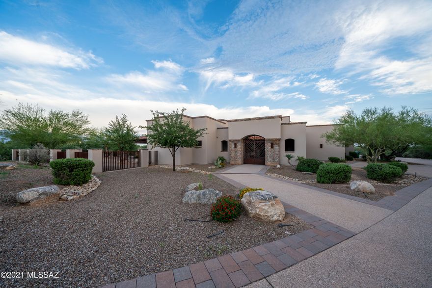 Looking for your very own desert oasis? Beautiful 6 bedroom home located on Tucson's NW side, nestled amongst panoramic views of the Santa Catalina Mountains.This expansive property comes with several amenities including a private guest house. With a spacious covered patio, a custom outdoor kitchen, pool and spa. Enjoy the best things Arizona has to offer from the comfort of your very own backyard. Lavish Master Suite with fireplace, private patio and an exceptional bath experience. Stunning granite counter tops in the kitchen with stainless steel viking appliance, and an open dining area. The great room highlights a gorgeous fireplace, vaulted ceilings, exposed beams, and surround sound. This home is truly one of a kind.