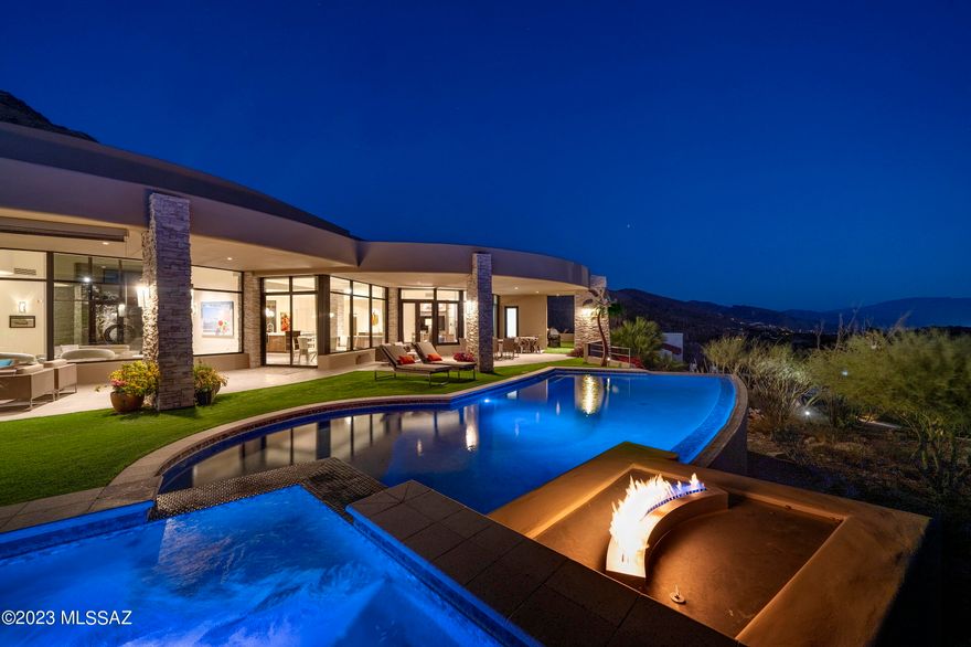A pure expression of contemporary architecture, located within the prestigious confines of Skyline Country Club, with inspiring city and mountain views that converge in a seamless panorama. Meticulously designed by Kevin Howard and crafted with an architectural vernacular that combines innovation and timeless design, setting a new standard for luxury living. Representing an unwavering commitment to craftsmanship and the tactile quality of materials, where lines and surfaces evoke a sense of perpetual motion, while simultaneously allowing one to become the curator of their own experience. The dialogue between interior and exterior is intentionally orchestrated to blur the distinction between form and nature. Expansive windows frame the surrounding landscapes, infusing each space with the ever-changing cadence of light and shadow. 

The kitchen, acting as a center point of the home, is not solely a culinary workspace, but invites its users to engage in the rituals of daily life, where activities become a sensory experience. Tones and textures, juxtaposed against natural stone and high gloss millwork create an intrinsic beauty found in the authenticity of the materials. At the heart of this epicurean experience is a suite of professional series appliances that merge functionality with a design-forward sensibility, elevating the art of the culinary experience.

The design ethos extends to the primary suite, where form and functionality coalesce. Every detail is carefully considered, from proportions, to the choice of materials, with bespoke cabinetry that seamlessly integrates within the space, while maintaining an uncluttered aesthetic that resonates within the broader design narrative.

Perfectly sited along the Southern edge of the residence, the outdoor spaces, sculpted from the natural topography, create an immersive living environment that echoes the contours of the structure. An elongated covered veranda overlooks the pool and spa, which become more than just amenities, but rather create a symbiotic relationship between the architecture and liquid landscapes, which include an elevated spa, acting as an intimate counterpart to the expansive pool. If you are looking for a home that challenges preconceptions, invites exploration, and leaves an indelible mark on the fabric from which this homesite was selected...look no further!