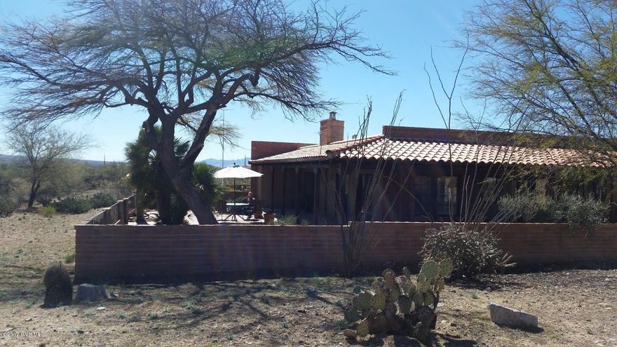 You will be proud to call this very popular Miramar Model, Home! Breathtaking, sweeping views of the Santa Rita mountains from your patio and from inside your home, including the master bedroom. Common area and walking trail in back to enjoy. Its your personal Hacienda! Kitchen is a convenient u-shaped with breakfast bar. Cabinets all have pull-outs, as well as mountain views overlooking the wrap-around patio. Separate breakfast area and formal dining room. Fireplace and wet bar in living area. Master bedroom and bath to die for! A mirrored walk-thru closet, long vanity with double sinks, large soaking tub and sep shower! Guest room has its own private patio and views of the sunsets. Huge oversized garage with cabinets and workbench space. This house is furnished, all ready to step in  a start living!