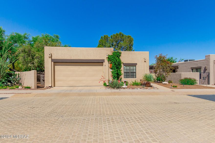 A rare find in the Ft Lowell Historic District. Former model, one of 3 free-standing homes with a larger lot. This patio home is move-in ready. Saltillo tile and wood flooring. Large recently remodeled kitchen. Chef-friendly kitchen with quartz counters and a large island with lots of storage. Vaulted wooden ceiling in Great Room. Screened patio. Freshly painted interior. Community pool and spa. Not many like this one!