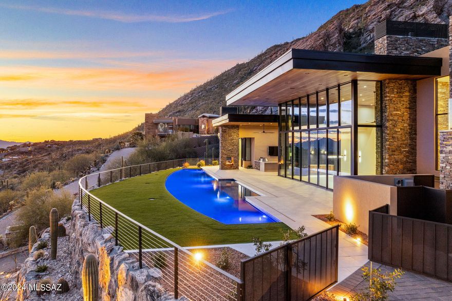 Perched atop the majestic and breathtaking Catalina Mountains, this one-of-a-kind modern masterpiece indulges all the senses and conveys the stunning desert southwest lifestyle on a highly desired 4.31-acre hilltop lot at the very top of Swan Road, in the coveted Summit gated community.  Luxurious attention to detail in every living space of this 5 bedroom, 7 bath, 6,788 SF oasis in the desert. Stunning floor to ceiling sliding windows provide electrifying panoramic city views, while the magnificent Catalina Mountains integrate seamlessly into the warm and functional outdoor entertaining space. High end finishes with eye-catching detail run throughout the home, while lush desert and regal saguaros embrace and surround the entire estate that boundaries with the Coronado National Forest. Elegant, modern, and masterfully designed by master builder Monty Bartholomew, with collaboration from Architect Bill Gansline, this home will set the standard for high end luxury living in Southern Arizona. Early purchase allows buyers the opportunity to work with builder on selecting finishes and cosmetic touches, which will enhance and define the overall feel and experience of owning this amazing, and one-of-a-kind home. Estimated completion December 2023.