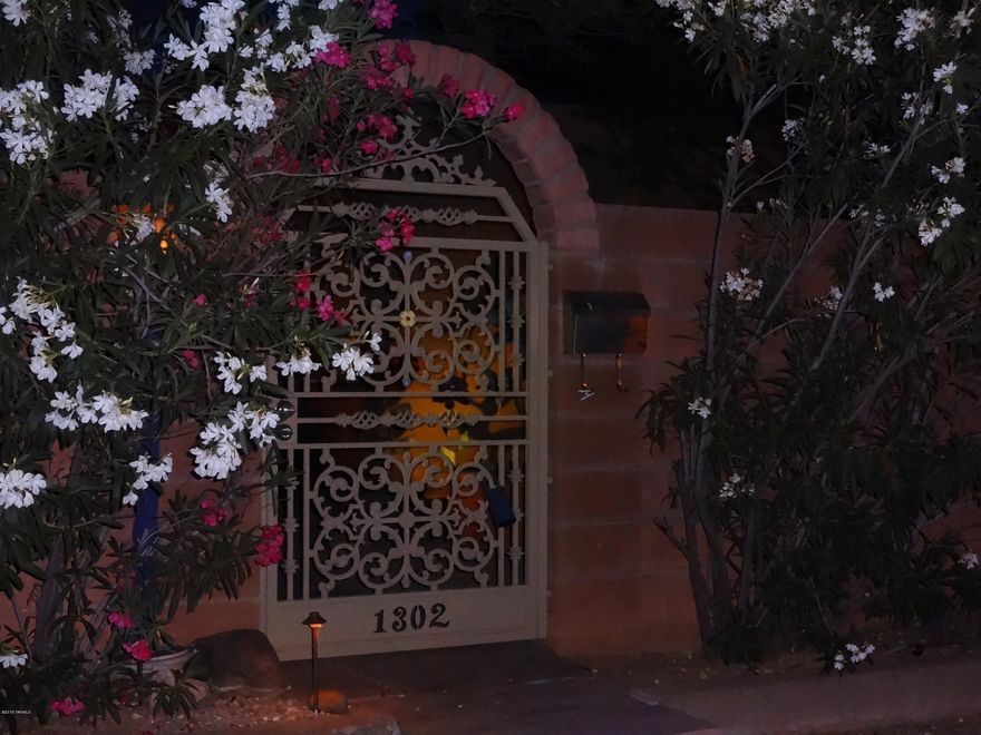 This renovated historic home located in Central Tucson, boasts pride of ownership.Enter through the front decorative iron gate into the soothing sound of water creating a peaceful respite.Open the door to the main house and your breath is taken away by the beauty of the partially wooden cathedral ceiling,double pane windows,and saltillo tile throughout. As you continue you will enter the custom kitchen which has all stainless steel appliances and an island made of indian marble with maple cabinetry. Open the oversized sliding doors and step out to the covered patio into the garden that was featured in Phoenix Home&Garden in 2013.There you will smell the herbs and lavender while being shaded by mesquite and palo verde trees.The guesthouse features 2  bedrooms 1 bath,kitchen,and laundry room