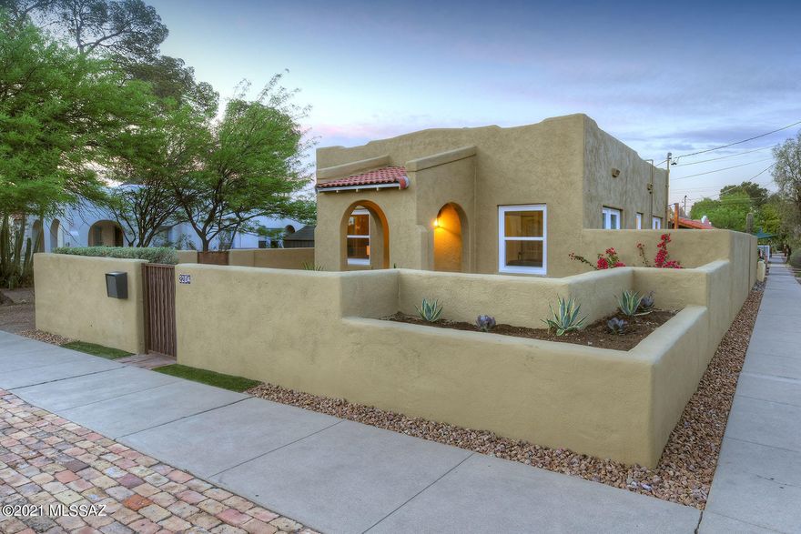 Sam Hughes Spanish/Moorish Bungalow plus Studio just steps from UArizona.  The perfectly appointed 758 sq foot home Built in 1926,  2 bed 1 bathroom home & fully remodeled.  Great room floor plan w/fireplace adjoins beautiful cooks kitchen w/new quartz counter tops, new SS appliances, tons of storage, pendant lights over breakfast bar.  Recessed lighting,, restored wood floors, freshly painted interior, new up-down blinds, new bathroom w/ soaking tub, new cabinetry, new dual pane windows throughout, Roof under warranty & more!  2 Cozy bedrooms. Front courtyard entry & backyard has brick pavers, cobalt blue Sail Shade, walled & private.  Plus a separate guest studio w/brick floors, clerestory windows, kitchenette, full bathroom. Separate storage & off street parking!