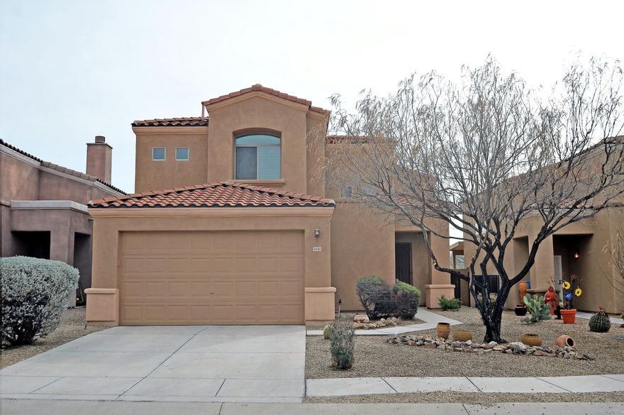 Great Location in Sahuarita/Green Valley! Privacy with no rear neighbors...Plus a View! This Spacious home includes neutral colors with tile flooring on the main level and carpet on the bedroom level. All bathrooms have tile. Nice size bedroom on main level. The great room open concept includes a dining/eating area. The roomy master bedroom has a walk in closet and en suite.  Also, enjoy the view and relax on the private deck off the master. The other two bedrooms feature a Jack and Jill full bathroom. This is a comfortable home with a good size, fully enclosed back yard. All of this is conveniently located within walking distance to new stores and restaurants. Oh...and By the Way...Extended 2 Car Garage!