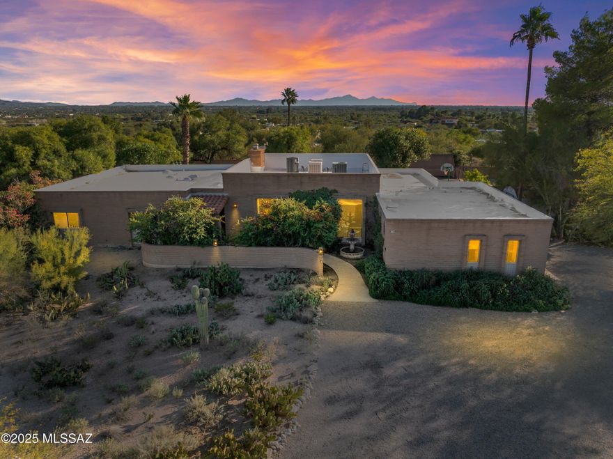 Welcome to your dream home! This exceptional ranch-style retreat offers 5 spacious bedrooms, 4 bathrooms, and 3229 square feet of thoughtfully designed living space: all on nearly one acre in one of the area's most coveted neighborhoods. Enjoy breathtaking mountain views from the front and experience true resort-style living in the backyard. Spend sunny days lounging by the sparkling swimming pool, soaking in the above-ground hot tub, or entertaining in the backyard ramada. Sports enthusiasts will love the private court, perfect for basketball, pickleball, and a variety of recreational activities. For those with a green thumb, a fenced garden area is ready for planting your favorite flowers or vegetables. Crafted with timeless slump block construction, this single-level home combines classic character with modern functionality. Large windows fill the flexible floor plan with natural light, while mature trees and a corner lot offer privacy and charm. Additional features include owned solar panels for energy efficiency and abundant storage throughout the home. Don't miss your chance to own this rare slice of paradise. Schedule your private tour today and experience the perfect blend of comfort, style, and outdoor living!