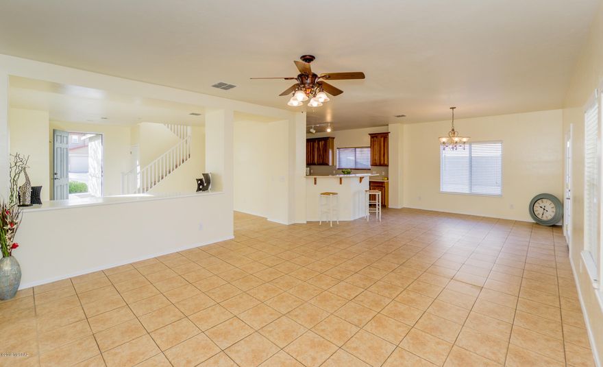 Fantastic 3BD / 2.5BA + Loft / 3 CAR GARAGE home in the heart of Santo Tomas Villas neighborhood.  Enter this 2250 sqft two story home into a living room that opens to a spacious family/dining room with breakfast bar. Kitchen with upgraded cabinets, Corian counters, SS appliances, NEW MICROWAVE and pantry closet. Main floor with ceramic tile flooring and convenient powder room. FRESH INTERIOR PAINT and NEW CARPET. The Upstairs boasts 3 comfortably sized bedrooms, including the Master Suite with partial MTN views, large walk-in closet and dual sink vanity. You'll also find a huge loft area that can be used for a play room, media room, studio or office space and the laundry is conveniently located on this floor. Enjoy your afternoons at the backyard with extended porch. LOW HOA . LOW HOA only $20/month. Great location close to shopping and easy access to 1-19.