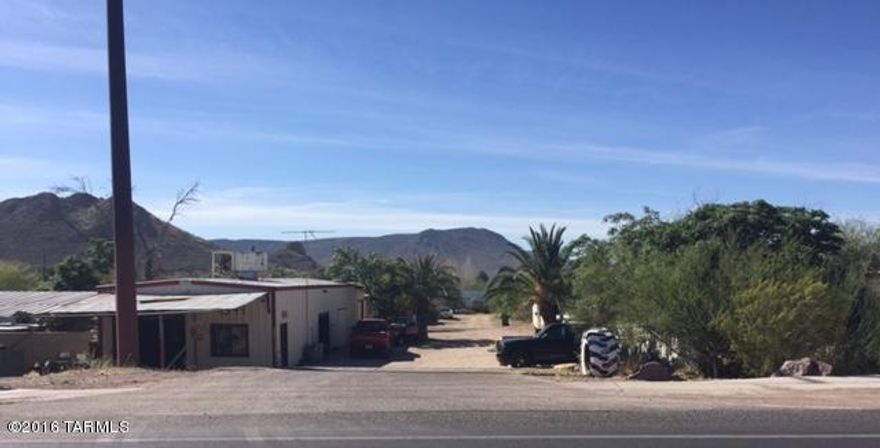 Investment opportunity. 1400 square foot  commercial building with longer term lease to an established business. Mobile home park that has six spaces.  5 park owned units and one leased space all on month to month leases. All units have individual water meters behind the main that are read by the manager on a monthly basis. All other utilities are paid for by the tenant as well. Don't miss this great opportunity for a cash flowing investment. Please do not disturb tenants.