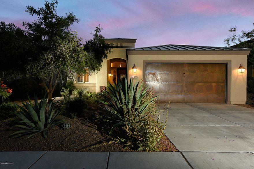 Lovely home , well maintained in gated skyranch! Preserved common area behind property. Kitchen features upgraded cabinets, granite countertops and new SS Appliances. Great room has cozy stacked stone fireplace, dramatic 14 feet high ceiling with high decorative windows bringing in natural lighting. Stunning concrete floors. Back yard is quiet backing up to natural desert where you can enjoy those lovely sunsets sitting in your hot tub. Garage doors are rustic metal facing. Home is like new only been lived in several months a year since it was built.