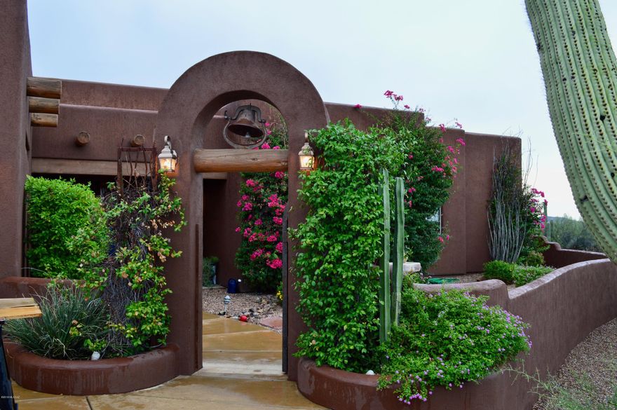 This 3.6 acre Southwestern style home is located on west Ina Road in Sombrero Shadows, a gated community rich with true southern Arizona beauty. Stepping into your new home will have you awestruck as you peer through your backyard oasis to majestic mountain views. Entertaining will be a breeze in this 3,855 square foot home with your built-in BBQ and salt water pool and spa. This open floor plan will give quick access to the granite countertops in your kitchen equipped with stainless steel appliances, hooded gas range and walk in pantry. Take a quiet evening in, sitting next to your second fireplace in your master bedroom which has a beautiful garden tub and a spacious walk-in closet.  Did we fail to mention the four car garage and full RV hookup on the side?  This is a must see home.