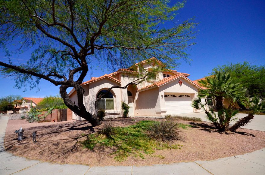 Great value for this 5 bedroom, 3 car garage Oro Valley home.  Brand new carpet installed throughout the home March 2016.  Every room has just been freshly painted -including doors and baseboards. Plus great news: no polybutylene plumbing!!  Fireplace and art niches in family room. Spacious and private backyard with mature landscape - extended brick paved patio area. Some nice mountain view from several rooms.  Spacious family room + spacious living and dining rooms. Stylish banister staircase.  Sprawling master bedroom.   Abundant fan/light combos throughout home. Laundry room has storage cabinets.  3 car garage has utility sink and storage units. With fresh paint and brand new carpet throughout this home is move in ready.