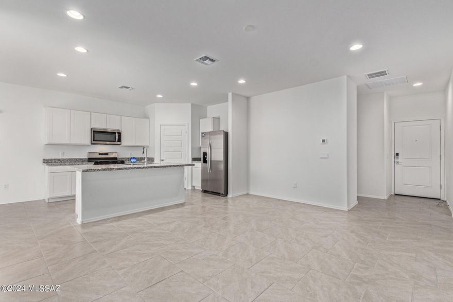 Our popular Baxter plan is what you have been looking for. Split plan gives the owner privacy while a comfortable great room allows for entertaining. Kitchen comes with 36'' white shaker cabinets, Bengal white granite, and 18 x 18 Cabris tile. Installed DuPure® Ultra Filter Single Stage® Water Filtration and Rinnai® Tankless Water Heater. 9-foot Ceilings and many D.R. Horton Smart Home features! Neighborhood Walking Paths, Tot Lot with 1/2 BB Court, Ramada & BBQ Grill! PLUS Beautiful Community Views of the Catalina Mountains!!! You will not be disappointed. Come take a look!
