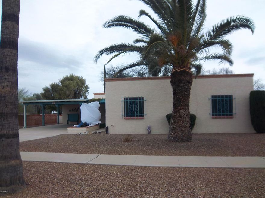 Very well maintained home, formal dining room could be used as den or hobby room, large living room with gas beehive fireplace. Guest room is very large. Mountain views from the large covered back patio. Large laundry room off breezeway, separate work shop room also off the breeze way with it's own door. Long driveway for extra parking. This is an age restricted property and is a part of Green Valley Recreation.