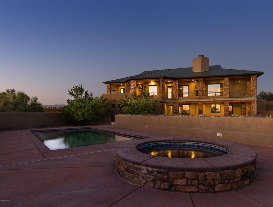 Rocking K Luxury Estate! Custom Built 4BD/4BA 4902 sq’ home on 3.8 Acres. Gourmet Kitchen with Knotty Alder Custom Cabinetry. Library. Panoramic Views. Australian Cypress Wood Flooring. Exquisite Throughout! Bonus Hobby Room! Master Bedroom has 2 Walk in Closets, Gas Fireplace & Private Screened In Patio. Walkout Basement boasts huge Family Room, Game Area & Wet Bar with all amenities. Beautifully Landscaped & irrigated backyard w/ fruit trees, heated lap pool & spa is perfect for entertaining & family needs. Relax upon the expansive covered Patio or extended Balcony with Built in Barbeque Area & fireplace & watch the magnificent Tucson sunsets. Rare Heated/Cooled Vault Room. Massive 3 Car Oversized Garage w/ large attached workshop & storage. Too many upgrades to list!  Must See! $849,0